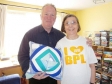 Mike receives a cushion made and donated by Anne Skidmore