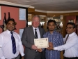 Mike Penning presents a certificate to the Cinnamon Lounge in Kings Langley as runner up for the Tiffin Cup nomination