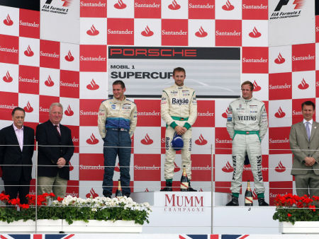 Mike on the podium with winners of the Porsche Mobil 1 Supercup 2011, (Round 5 Silverstone)