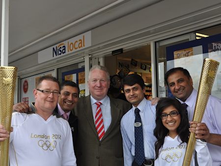 Mike Penning MP joins Olympic torchbearers Gary Bilbrough and Misha Patel at Nisa Local, Crabtree Lane
