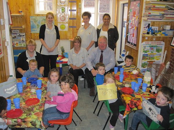 Mike Penning helps children St Nicholas Nursery celebrate World School Milk Day