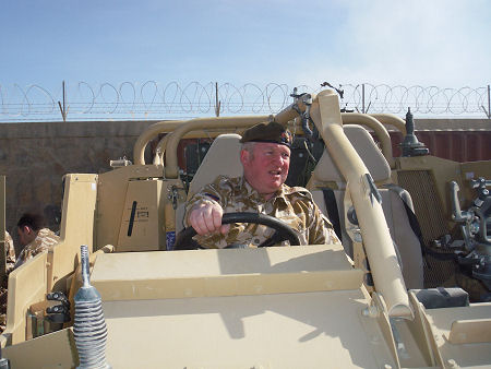Mike driving an armoured vehicle in Afghanistan